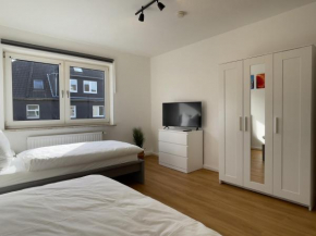 Happy Suites - WIFI, Einzelbetten, TV, Parkplatz,